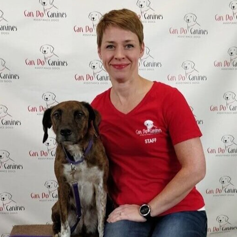 Cari Bishop sitting with a dog