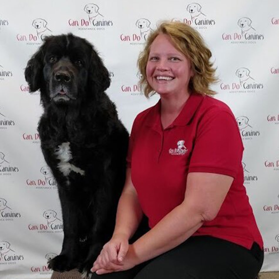 Elizabeth Reberk sitting with a dog