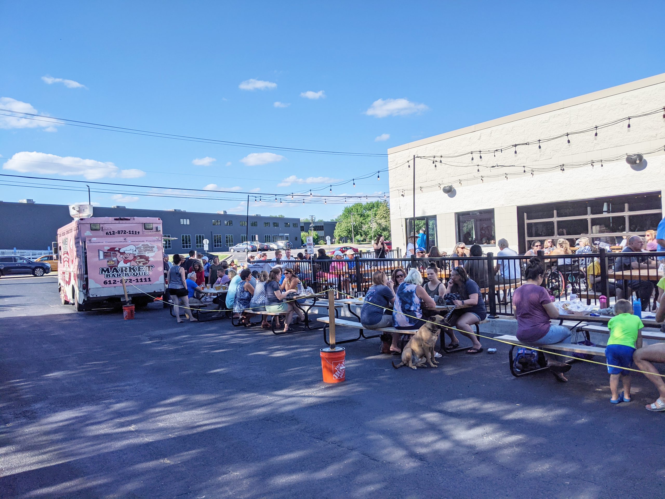 Crowd on business patio with food truck
