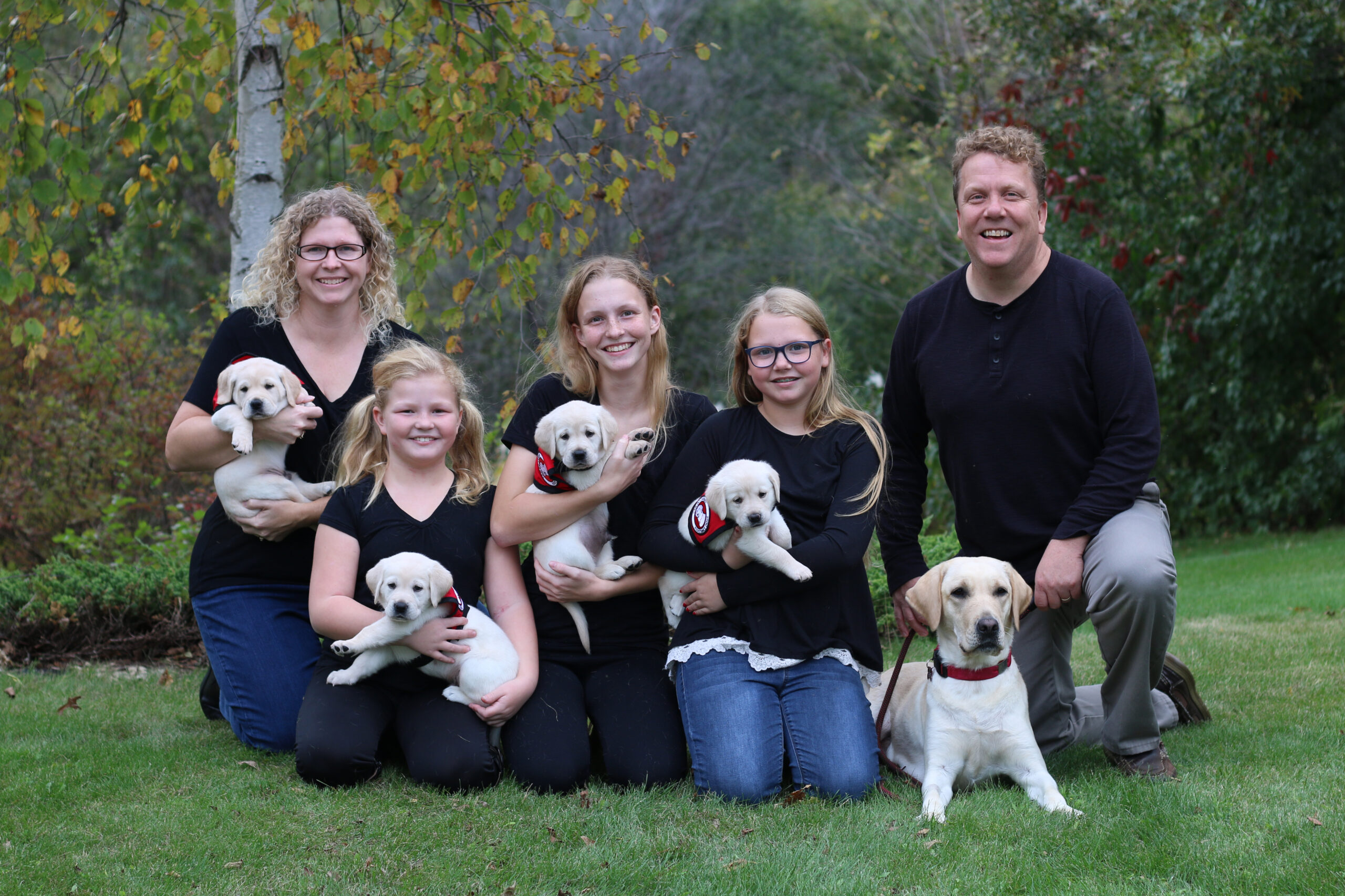 Wahl family with puppies