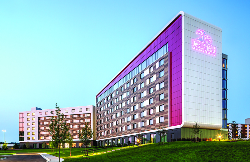 exterior view of Treasure Island Resort & Casino white and pink building