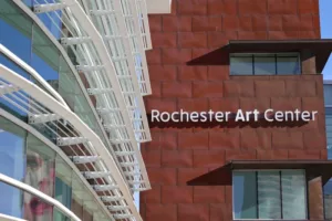 Red brick building with text that reads, Rochester Art Center