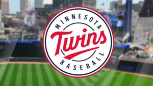 Blurred photo of baseball field with crowd and logo in foreground for Minnesota Twins Baseball