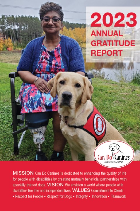 Cover of 2023 Annual Gratitude Report for Can Do Canines with woman sitting in wheelchair outside near pond with yellow Lab service dog sitting next to her; Mission and Vision statements for Can Do Canines printed on bottom of page