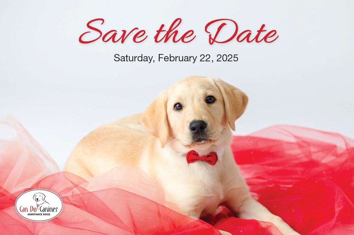 Yellow Lab puppy wearing red bow tie and lying on red toulle fabric looking at camera; text says "Save the Date Saturday, February 22, 2025," with Can Do Canines logo